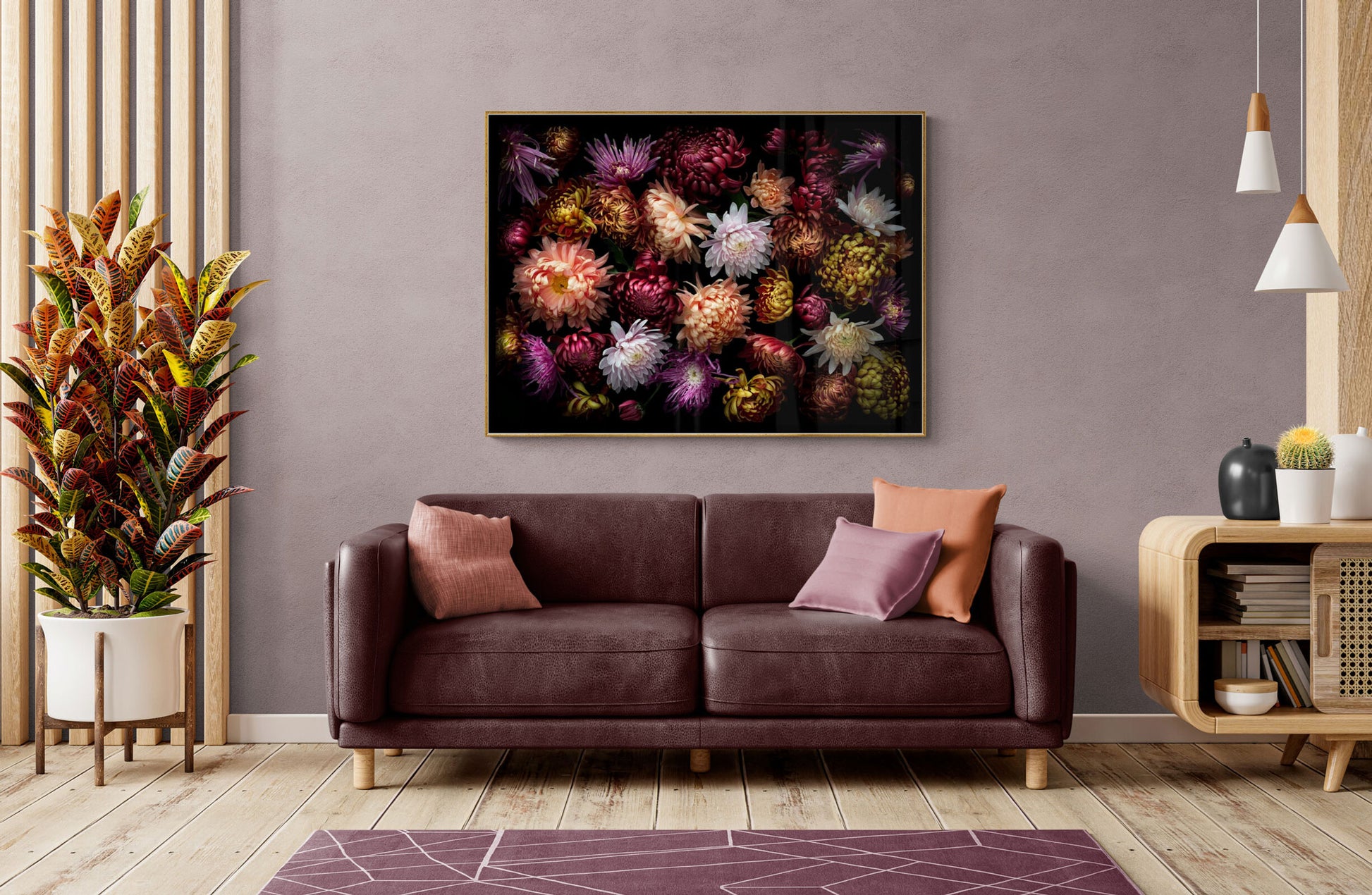 Landscape  format dark botanical print of multi-coloured heritage Chrysanthemums photographed on a black background hung above a sofa