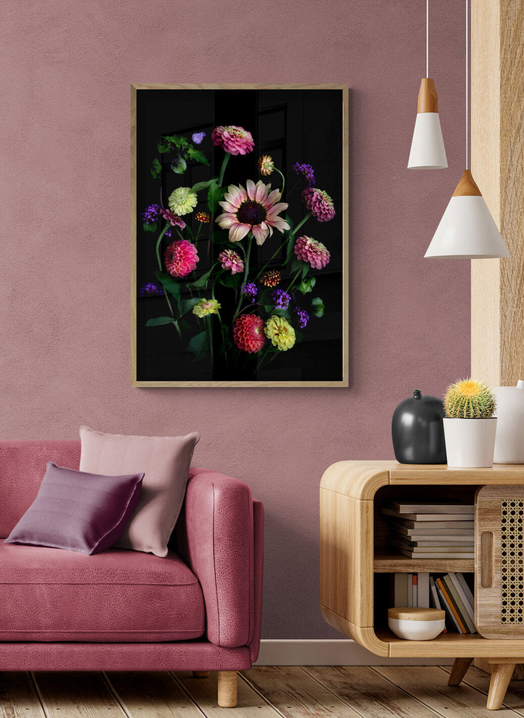 A botanical print featuring a Sunflower with Zinnias, Dahlias, Verbena and a touch of the Shoo Fly plant, Nicandra physalodes., framed on a peach coloured  wall.